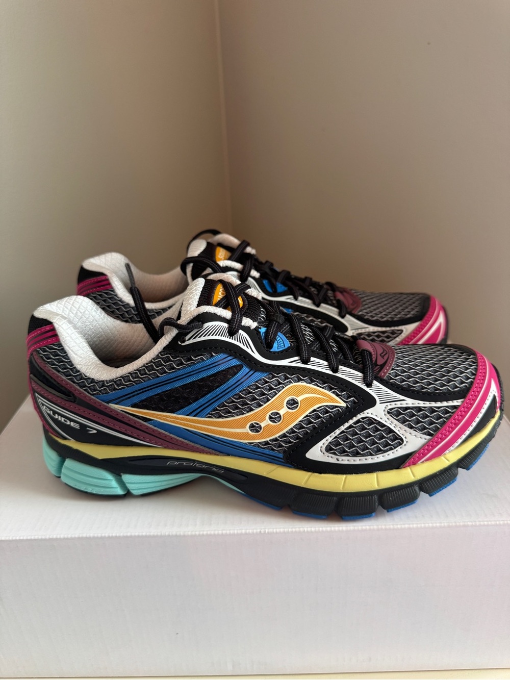 Brand New Saucony ProGrid Guide 7 sneakers in a "Multi-Color Black" colorway.